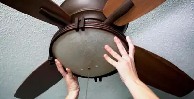 Ceiling fan repair and reinstallation on ceiling mount in Denver, CO