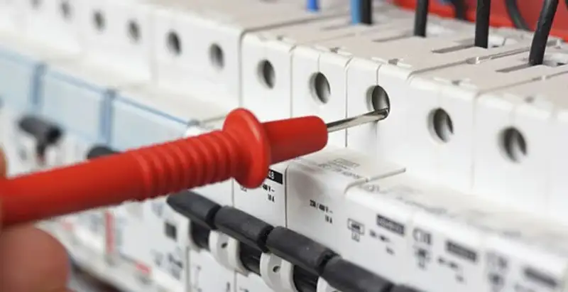 Electrical contractor testing circuit breakers during electrical repair in Aurora, CO