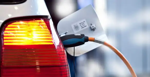 Electric car plugged into EV charger after professional installation in Denver, CO