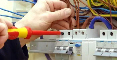electrician services performing professional electrical panel wiring and connections in Denver, CO