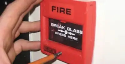 fire alarm installation service showing manual fire alarm pull station installed by licensed electricians in Denver, CO
