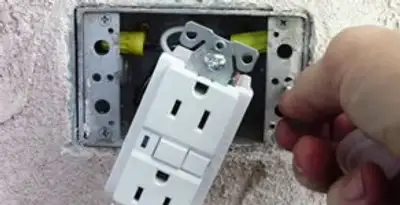 gfci circuits service showing installation of a ground fault circuit interrupter outlet by licensed electricians in Denver, CO
