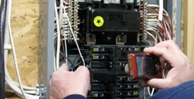 Home electrical inspection of circuit breaker panel by licensed electrician in Denver, CO
