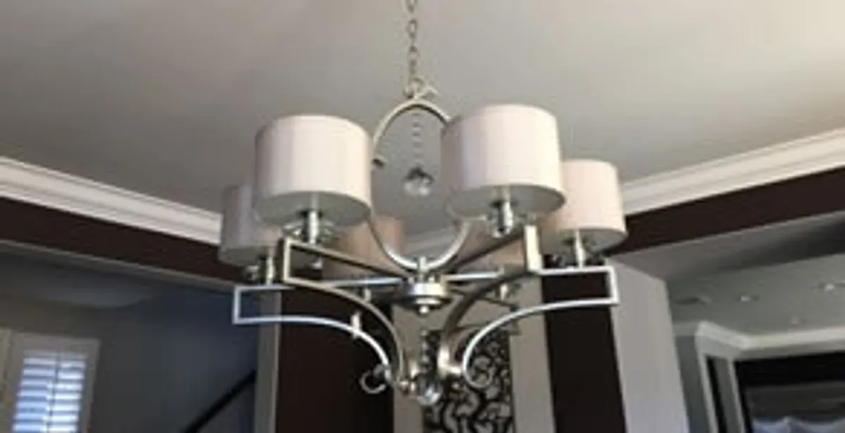 Modern chandelier installation with multiple light fixtures in Denver, CO