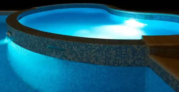pool light installation and repair services highlighting illuminated pool interior lighting in Denver, CO
