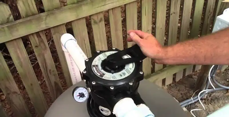 pool pumps service showing professional adjustment of pool pump control system in Denver, CO