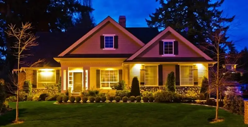 security light installation services illuminating a residential exterior at night in Denver, CO