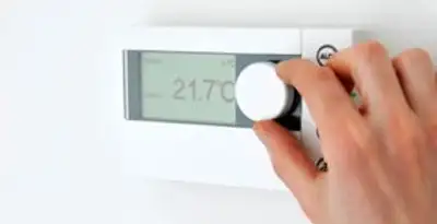 Thermostat installation service with professional adjusting temperature control in Denver, CO