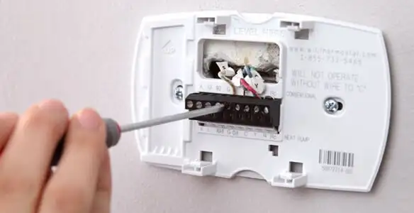 Thermostat installation service with proper wiring and secure wall mounting in Denver, CO