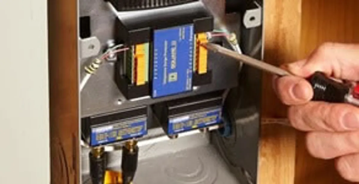Whole home surge protection device being installed by a licensed electrician to protect electrical systems in Denver, CO